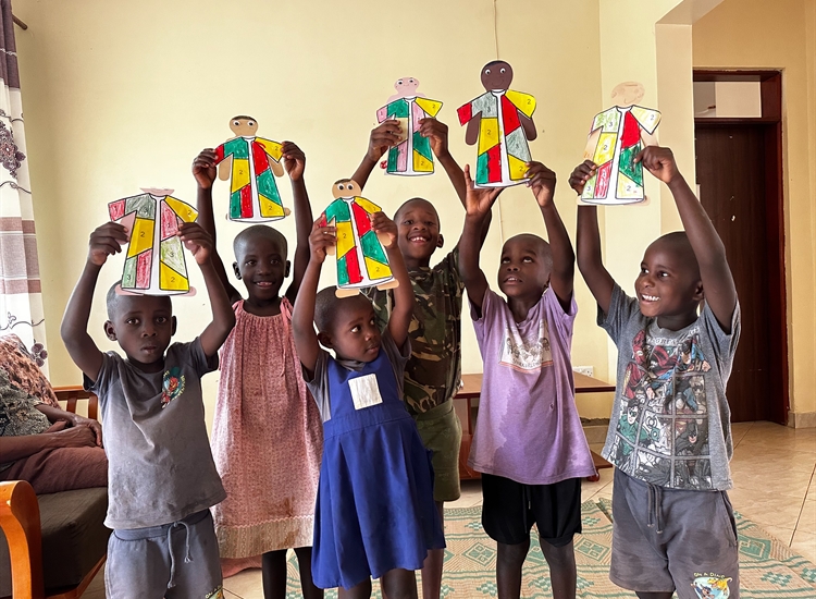 Children holding up Crafts