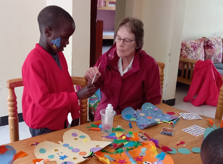 Sue making crafts with the children