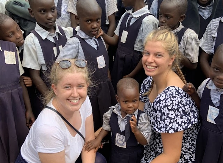 Emily and Chloe with School Children